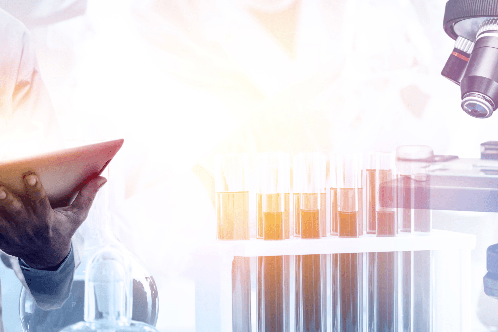Double exposure image of scientific and medical lab instrument, microscope, test tube and glass flask for microbiology and chemistry in laboratory for medicine study. Source: Blue Planet Studio | Canva Pro